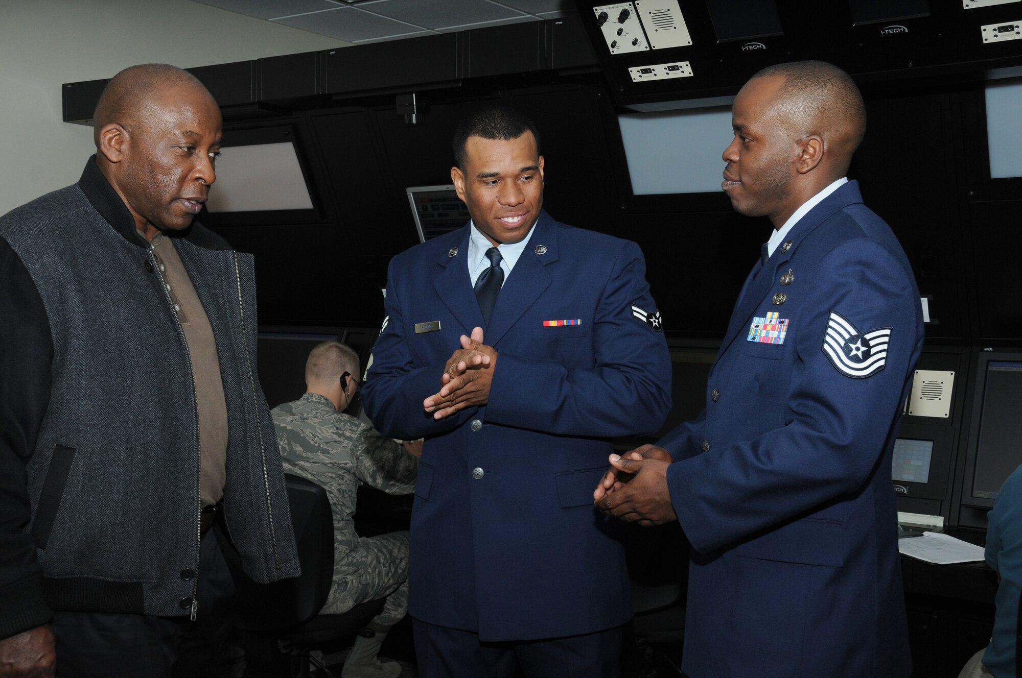 Ronald Brown, retired U.S. Air Force major from Arizona, visits with his sons Airman 1st Class Christopher Brown, 334th Training Squadron student, and Tech. Sgt. Ronald Brown Jr., 334th TRS instructor supervisor, following Airman Brown’s graduation ceremony from the air traffic control apprentice course March 7, 2012, at Cody Hall, Keesler Air Force Base, Miss.  Tech. Sgt. Brown was the master of ceremonies for the event.  (U.S. Air Force photo by Kemberly Groue)