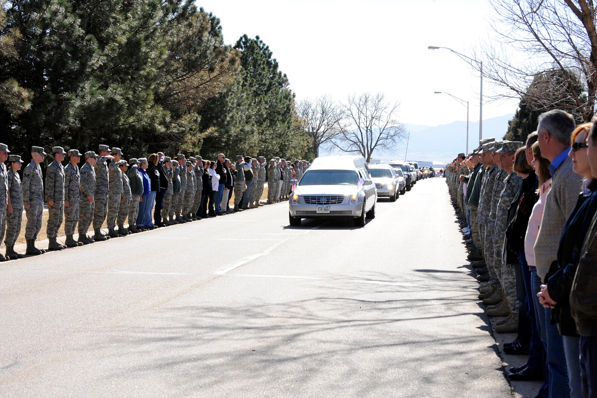 PETERSON AIR FORCE BASE, Colo. -- Team Pete lined Peterson Boulevard March 9 to pay respects to Capt. Ryan Hall from the 319th Special Operations Squadron. Hall, a resident of Colorado Springs, was killed in an aircraft accident in Africa Feb. 18. His funeral was held March 12 in the Cadet Protestant Chapel at the U.S. Air Force Academy, with interment at the USAFA Cemetery. 
Also killed in the accident were Capt. Nicholas Whitlock and 1st Lt. Justin Wilkens from the 34th Special Operations Squadron, and Senior Airman Julian Scholten from the 25th Intelligence Squadron. The four were all deployed from Hurlburt Field, Fla. The aircraft, a U-28, was returning from a mission in support of Operation Enduring Freedom. (U.S. Air Force photo/Rob Bussard)
