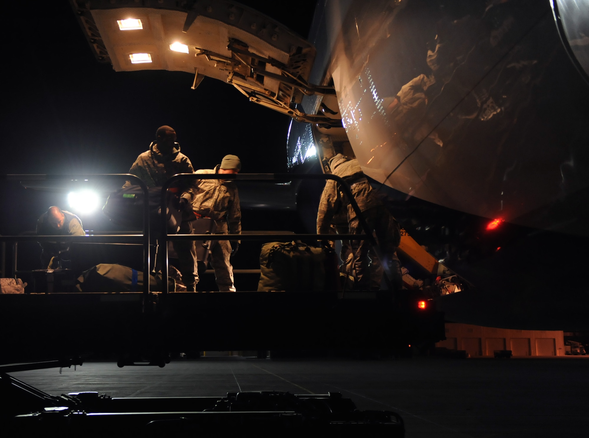 A group of Airman help load luggage into the cargo hold of a Boeing 767 March 12, 2012, at Mountain Home Air Force Base, Idaho. The jet is carrying approximately 200 Airmen from the 366th Fighter Wing to Southwest Asia to support Operation Enduring Freedom. (U.S. Air Force photo/ Airman 1st Class Jonathan Glanville/Released)