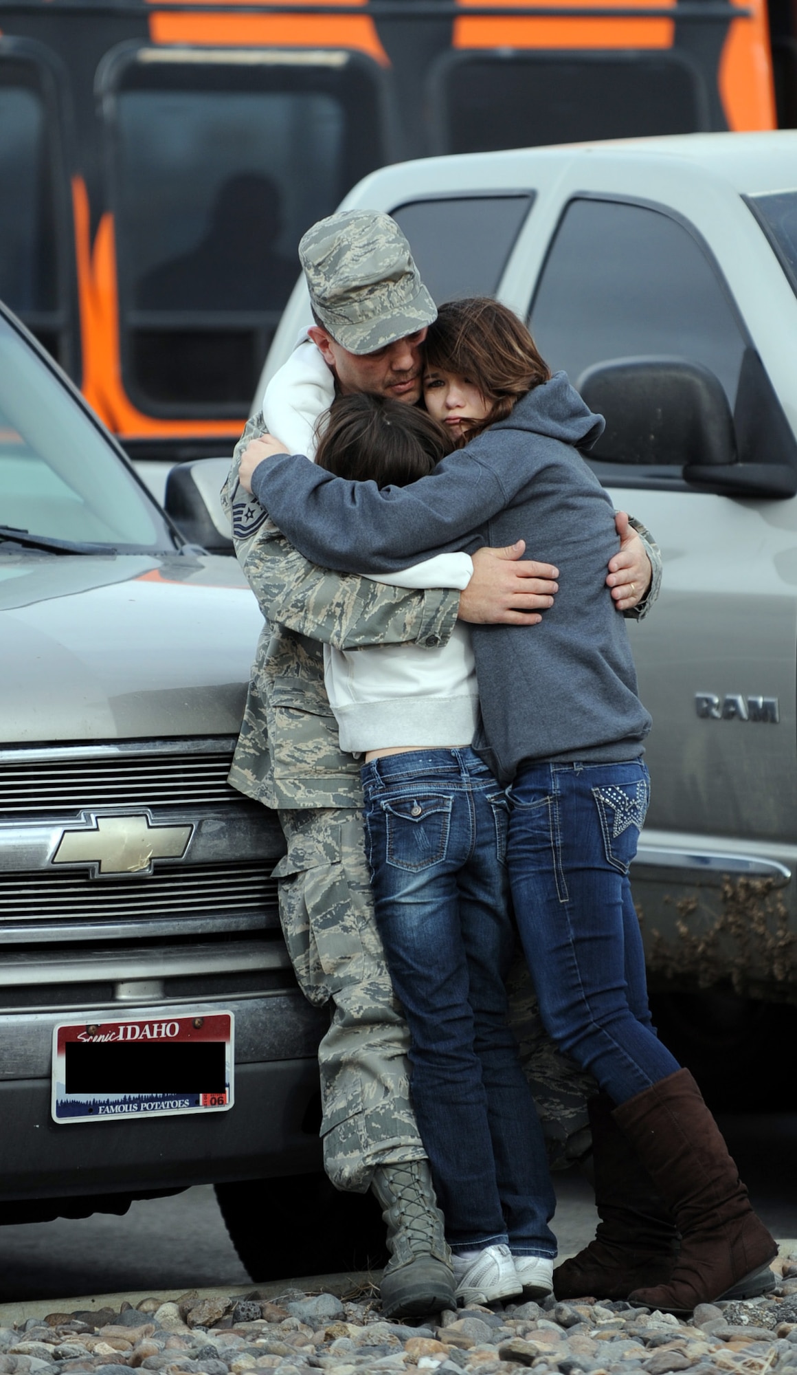 An Airman from the 366th Fighter Wing hugs his family goodbye before leaving for deployment to Southwest Asia from Mountain Home Air Force, Idaho. He is one of approximately 200 Airman from the fighter wing who deployed March 12, 2012, in support Operation Enduring Freedom. (U.S. Air Force photo/ Airman 1st Class Jonathan Glanville/Released)