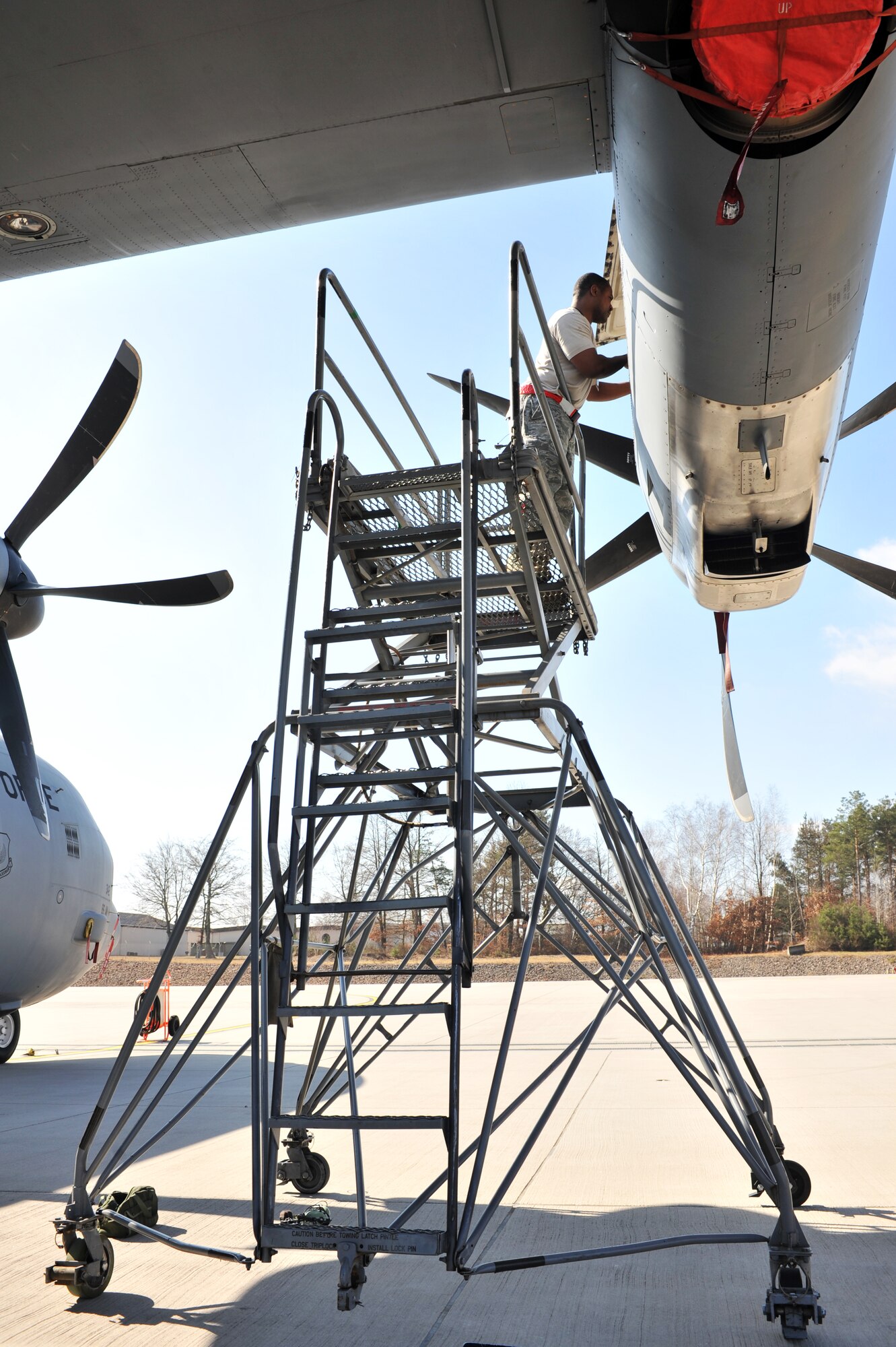Air Force Staff Sgt. Redus Reed, 86th Maintenance Squadron maintainers, performs engine maintenance on a C-130J Super Hercules, Ramstein Air Base, Germany, March 12, 2012. The 86th MXS Airmen work jointly with the 86th Aircraft Maintenance Squadron to ensure all assigned aircraft are 100 percent ready for take off. (U.S. Air Force photo/Airman 1st Class Caitlin O'Neil-McKeown)