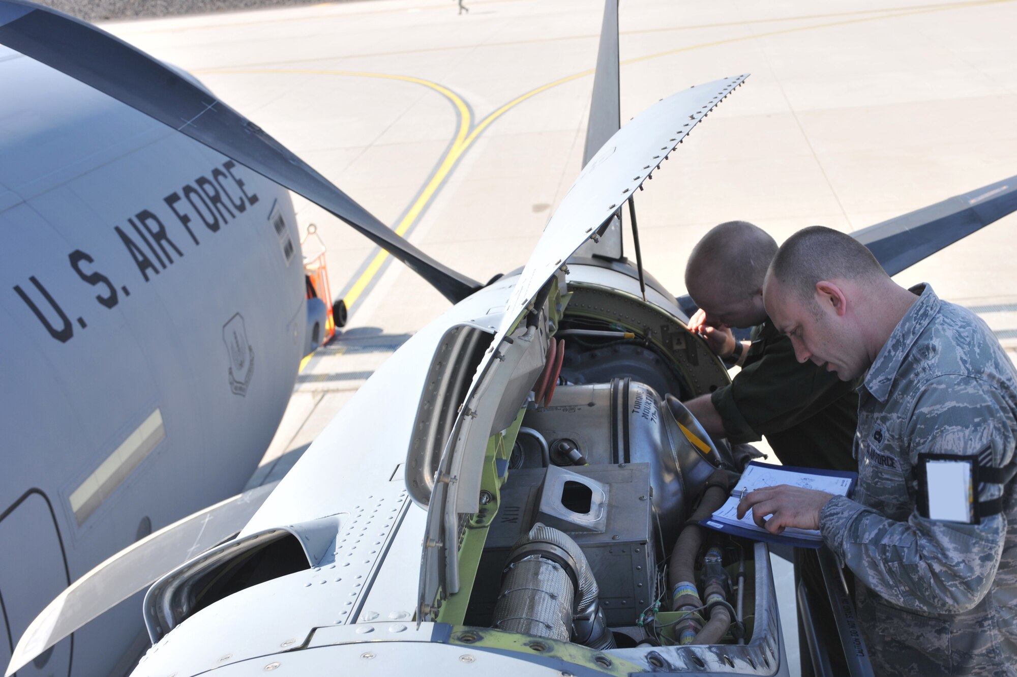 Air Force Tech. Sgt. Thomas Liter and Staff Sgt. Cameron Mitchell, 86th Aircraft Maintenance Squadron maintainers, perform engine maintenance on a C-130J Super Hercules, Ramstein Air Base, Germany, March 12, 2012. The 86th AMXS Airman ensure all assigned aircraft are 100 percent ready for take off. (U.S. Air Force photo/Airman 1st Class Caitlin O'Neil-McKeown)