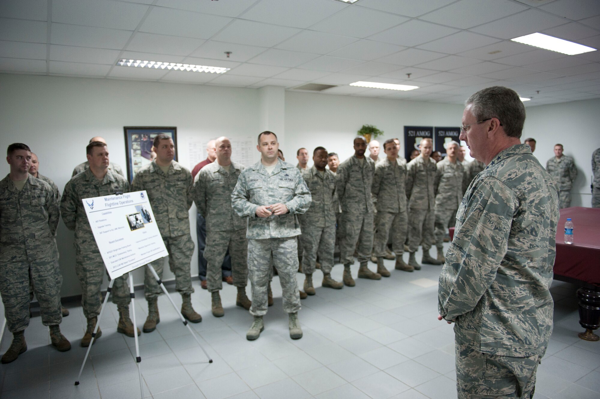 Master Sgt. Elijah Tatman, 728th Air Mobility Squadron, briefs Lt. Gen. Mark Ramsay, 18th Air Force commander, on maintenance flight operations March 12, 2012, at Incirlik Air Base, Turkey. Ramsay toured several facilities and visited Airmen to thank them for their service. (U.S. Air Force photo by Senior Airman Clayton Lenhardt/Released)
