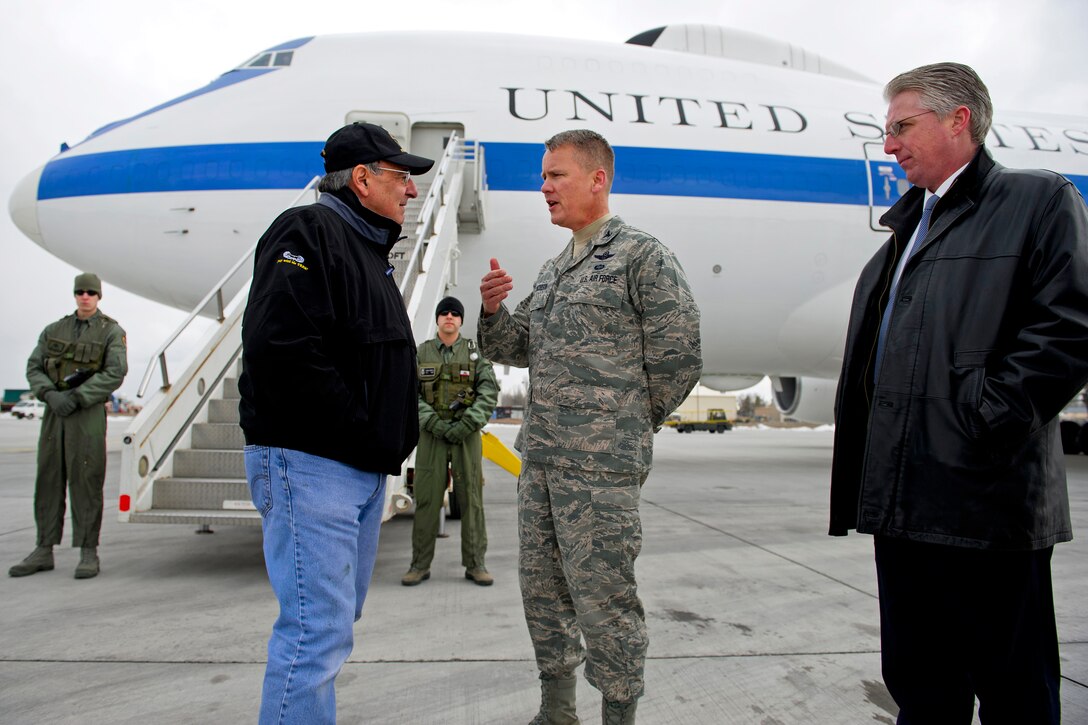 U.S. Defense Secretary Leon E. Panetta speaks with U.S. Air Force Col. James Jacobson, and David McCormick, U.S. Embassy acting deputy chief of mission, after arriving on Manas Air Base, Kyrgyzstan, March 13, 2012. Panetta is scheduled to meet with counterparts and troops during his visit in the country. Jacobson is commander, 376th Air Expeditionary Wing.