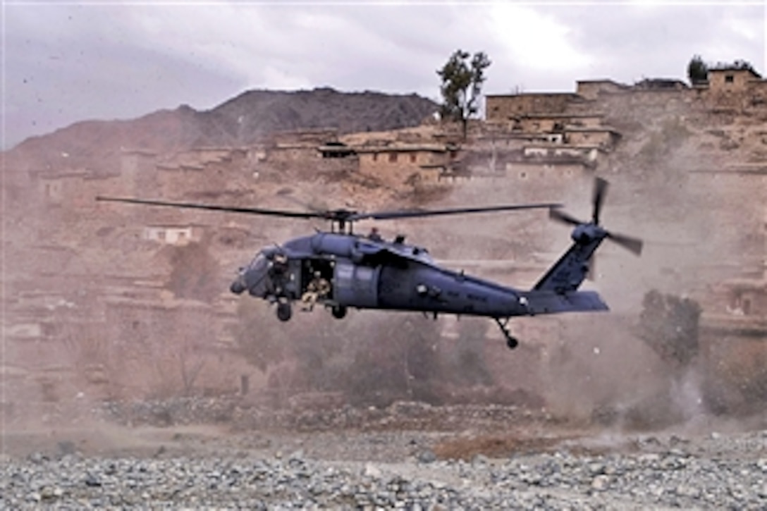A UH-60 Black Hawk helicopter lands to medically evacuate an Afghan commando injured by insurgent small arms fire in the Sar Kani district of Afghanistan's Kunar province on March 7, 2012.  