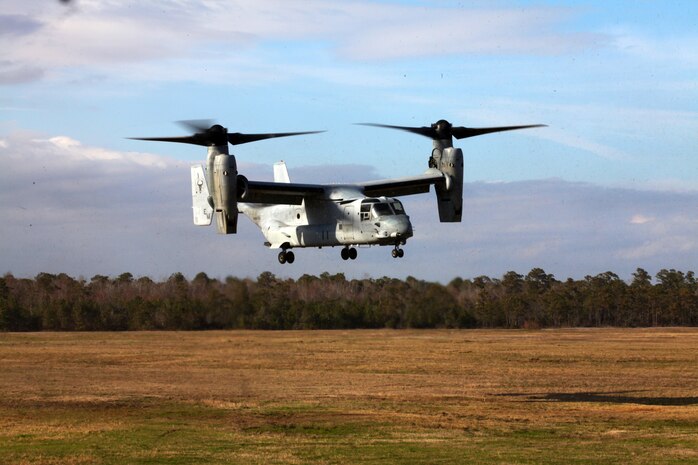 An MV-22 Osprey hovers above the ground March 13 during air delivery operations training at Landing Zone Falcon. The training certified Marines with the air delivery attachment of Combat Logistics Battalion 24, 24th Marine Expeditionary Unit in conducting air delivery operations.