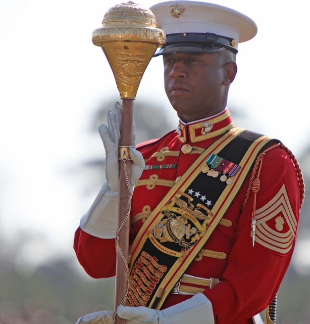 Master Gunnery Sgt. Kevin Buckles, the U.S. Marine Drum & Bugle Corps drum major, signals a command during a Battlefield Color Detachment ceremony aboard Marine Corps Base Camp Lejeune, N.C., March 14. Ending their National Installations Tour, the BCD featuring the U.S. Marine Drum & Bugle Corps, the U.S. Marine Corps Silent Drill Platoon and the Official Color Guard of the Marine Corps made their final appearance at Camp Lejeune.