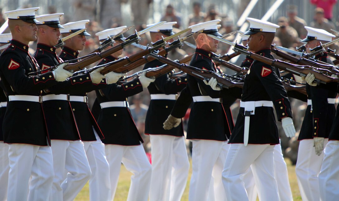 Marines with the U.S. Marine Drum & Bugle Corps perform for a packed crowd during a Battlefield Color Detachment ceremony aboard Marine Corps Base Camp Lejeune, N.C., March 14. Ending their National Installations Tour, the BCD featuring the U.S. Marine Drum & Bugle Corps, the U.S. Marine Corps Silent Drill Platoon and the Official Color Guard of the Marine Corps made their final appearance at Camp Lejeune.