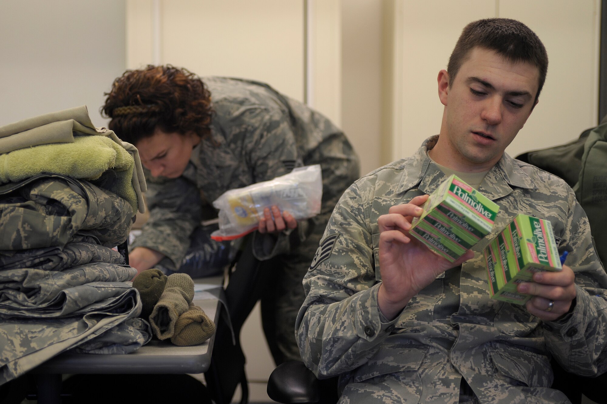 VANDENBERG AIR FORCE BASE, Calif. -- Staff Sgt. Levi Riendeau, 30th Space Wing Public Affairs Office member, checks his mobility bag items during a Northstar exercise bag drag here Thursday, March 8, 2012. A mobility bag consists of items essential for a deployer to have when tasked to deploy at a moments notice. (U.S. Air Force photo/Staff Sgt. Andrew Satran) 

