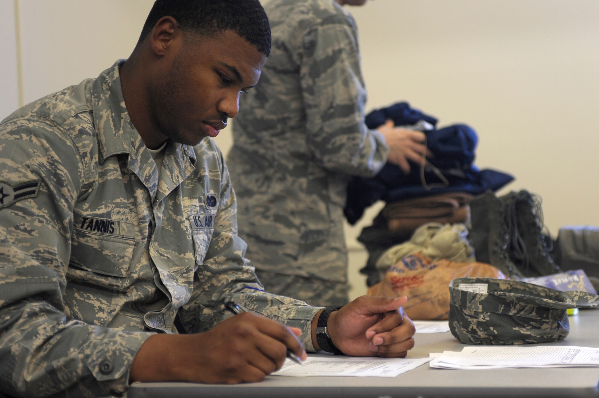 VANDENBERG AIR FORCE BASE, Calif. -- Airman 1st Class Darian Tannis, 30th Space Wing Judge Advocate member, checks his mobility bag list during a Northstar exercise bag drag here Thursday, March 8, 2012. A mobility bag consists of items essential for a deployer to have when tasked to deploy at a moments notice. (U.S. Air Force photo/Staff Sgt. Andrew Satran) 

