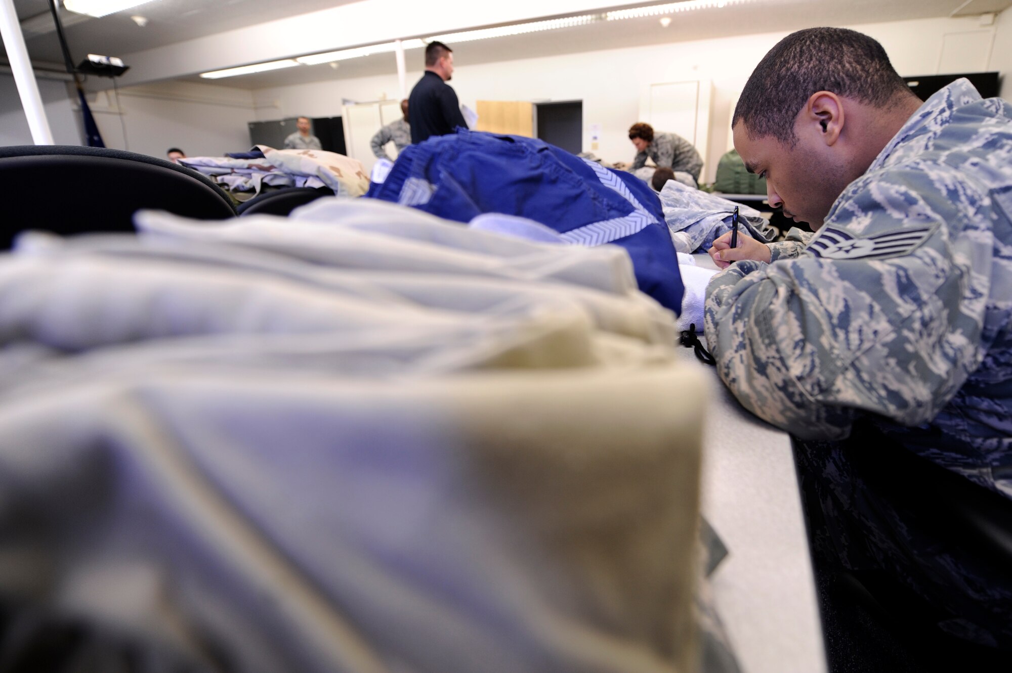 VANDENBERG AIR FORCE BASE, Calif. -- Staff Sgt. Eljurious Whiteside, 30th Space Wing Command Post member, checks his mobility bag list during a Northstar exercise bag drag here Thursday, March 8, 2012. A mobility bag consists of items essential for a deployer to have when tasked to deploy at a moments notice. (U.S. Air Force photo/Staff Sgt. Andrew Satran) 

