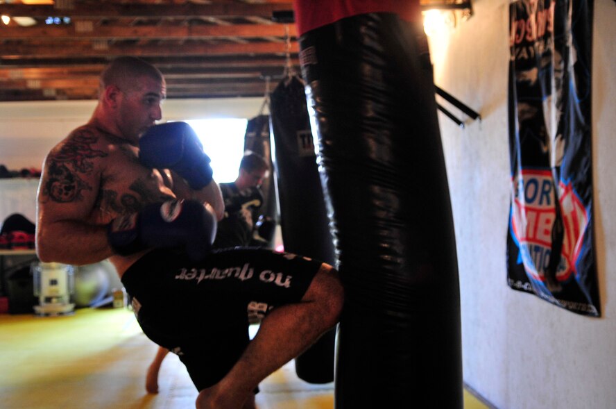 COLUMBIA - U.S. Air Force Staff Sgt. Ferdinando Acerra, a maintenance training instructor assigned to the 20th Medical Operations Squadron, 20th Fighter Wing, Shaw Air Force Base, S.C. practices knee kicks while training at the Sor Sumrit Muay Thai Gym in Columbia, S.C. on March 13, 2012. Acerra, along with two others from his gym will compete in matches at Shaw AFB's first ever MMA event on March 30, 2012. (U.S.  Air Force photo/Master Sgt. Cohen A. Young/Released)