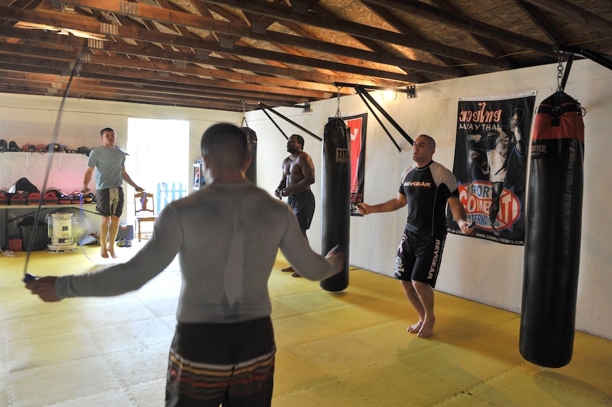 COLUMBIA - U.S. Air Force Staff Sgt. Ferdinando Acerra (right), a maintenance training instructor assigned to the 20th Medical Operations Squadron, 20th Fighter Wing, Shaw Air Force Base, S.C. jumps rope for conditioning alongside his mix martial arts peers while at the Sor Sumrit Muay Thai Gym in Columbia, S.C. on March 13, 2012. Acerra, along with two others from his gym will compete in matches at Shaw AFB's first ever MMA event on March 30, 2012. (U.S.  Air Force photo/Master Sgt. Cohen A. Young/Released)