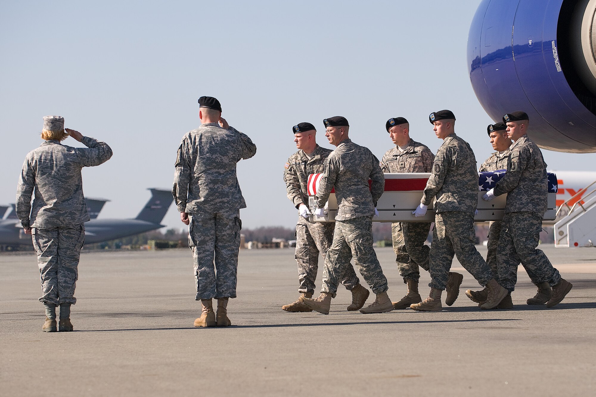 A U.S. Army carry team transfers the remains of Army Staff Sgt. Jesse J. Grindey, of Hazel Green, Wis., at Dover Air Force Base, Del., March 14, 2012. Grindey was assigned to the 287th Military Police Company, 97th Military Police Battalion, 89th Military Police Brigade, Fort Riley, Kan. (U.S. Air Force photo/Steve Kotecki)
