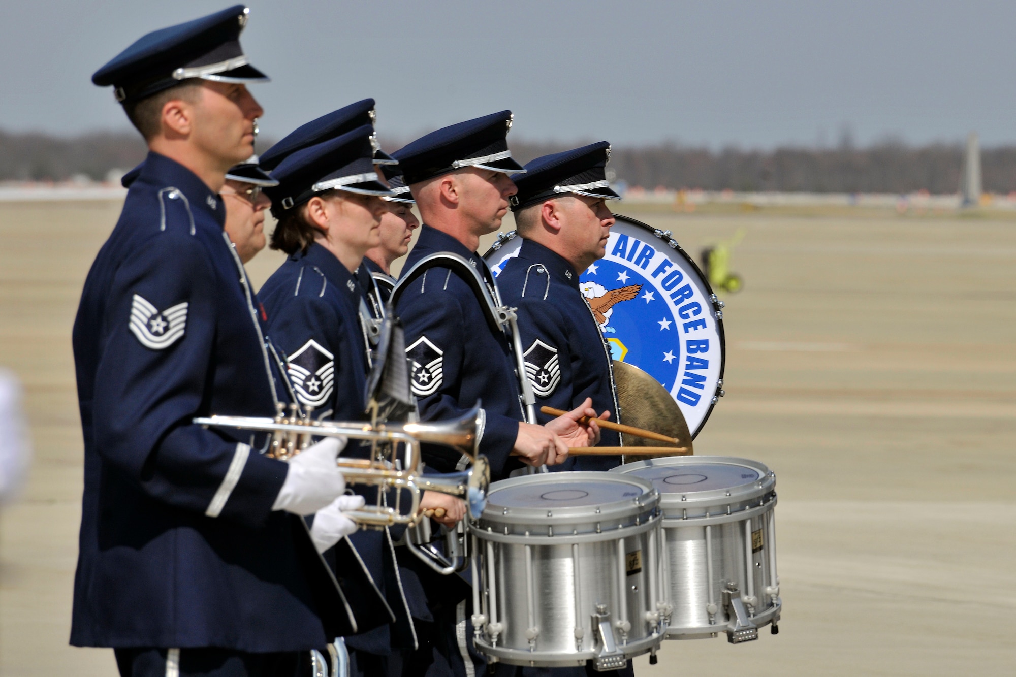 The U.S. Air Force Band's Ceremonial Brass marches away from the Joint Base Andrews, Md., flightline on March 13 after participating in an arrival ceremony for British Prime Minister David Cameron. (U.S. Air Force photo/Senior Airman Perry Aston)
