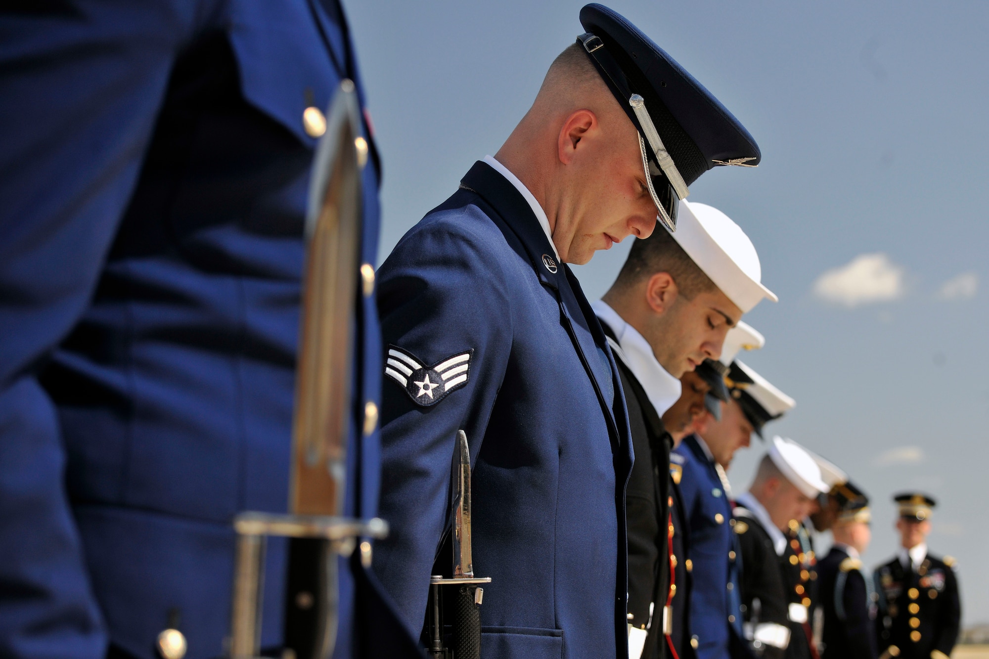 A joint service honor guard practices before British Prime Minister David Cameron arrives on the Joint Base Andrews, Md., flightline March 13. During his visit, the prime minister met with the president to discuss boosting economic growth, Iran, Afghanistan and Syria. (U.S. Air Force photo/Senior Airman Perry Aston)