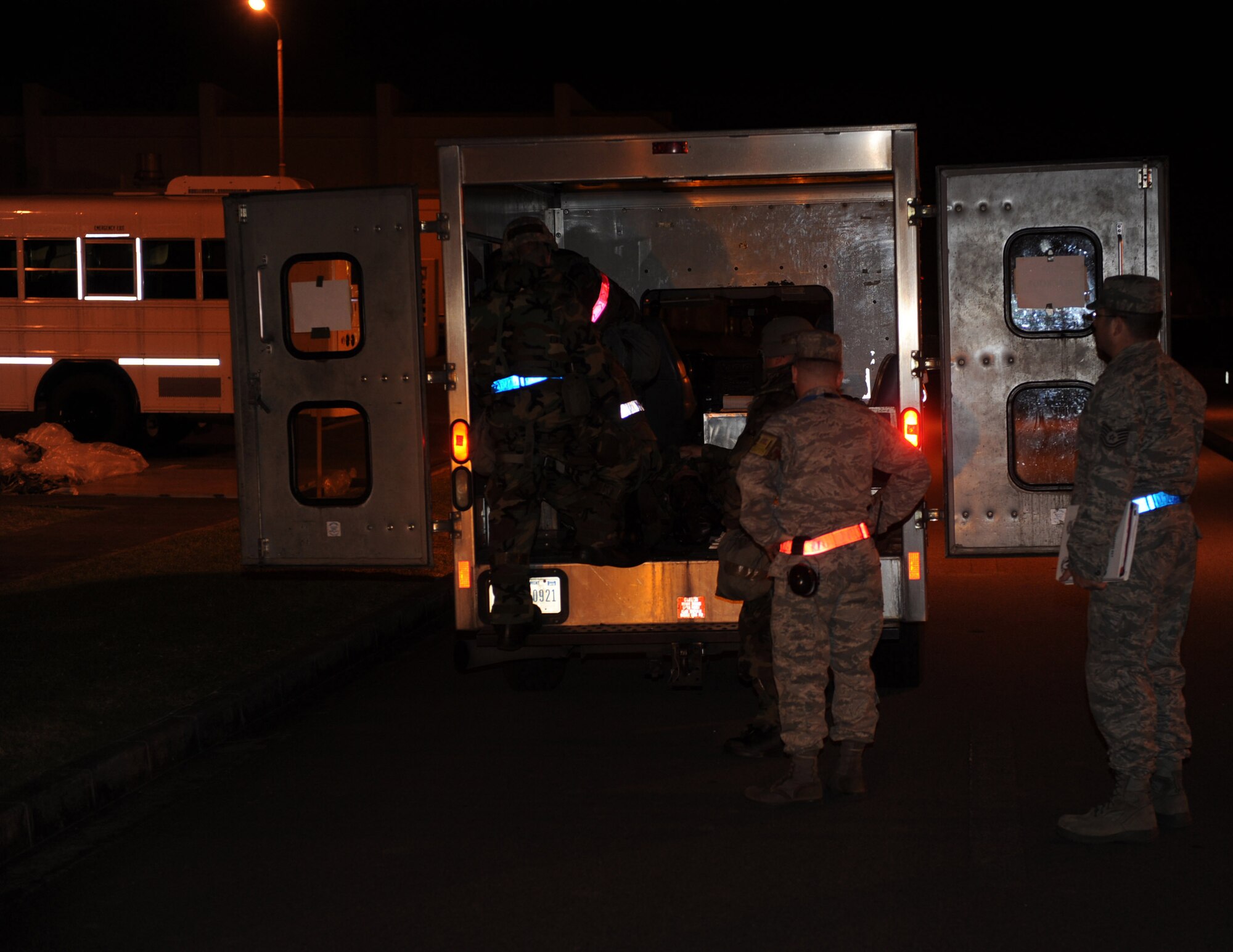U.S. Air Force service members get into an ambulance to check on a mock victim who was hurt falling from the top of an F-15 fighter jet during local operational readiness exercise Beverly High 12-3 on Kadena Air Base, Japan, March 14, 2012. Kadena is participating in a LORE to prepare Airmen for future contingencies. (U.S. Air Force photo by Airman 1st Class Justin Veazie/released)