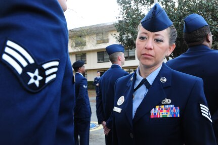 Staff Sgt. Patti Jones inspects a student's dress uniform during Airman Leadership School at Joint Base Charleston - Air Base Mar. 5.  Jones is a 628th Force Support Squadron ALS instructor. (U.S. Air Force photo/Staff Sgt. Katie Gieratz)
