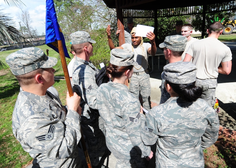 Airman Leadership School students participate in the Nwoknu tribe exercise at Joint Base Charleston - Air Base Mar. 2. The students play different roles; some Airmen dress  as members of the tribe while others play members of a convoy team. The exercise demonstrates the importance of effective communication and possible communication barriers that relate to global diversity and regional awareness that can occur while on a deployment.  (U.S. Air Force photo/Staff Sgt. Katie Gieratz) 
