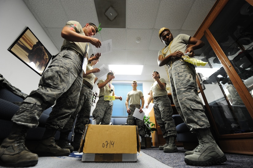 Airman Leadership School students prepare to participate in the Nwoknu tribe exercise at Joint Base Charleston - Air Base Mar. 2. The exercise demonstrates the importance of effective communication and demonstrates possible communication barriers that relate to global diversity and regional awareness that can occur while on a deployment. (U.S. Air Force photo/Staff Sgt. Katie Gieratz) 
