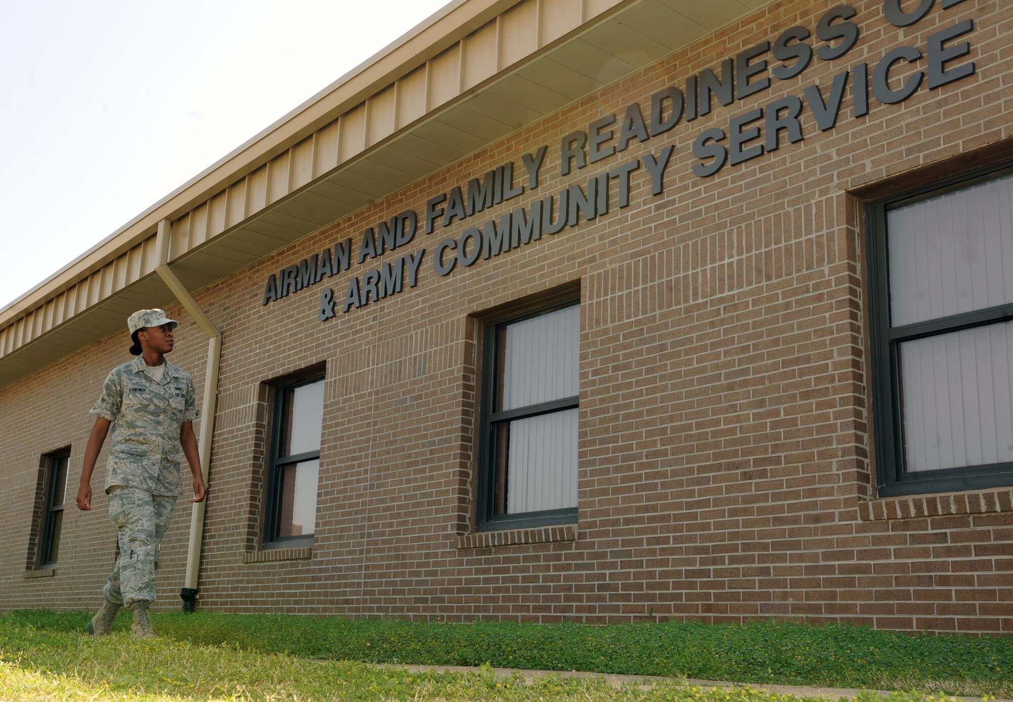 U.S. Air Force Airman 1st Class Ashley Gardner, 20th Fighter Wing Public Affairs photographer, walks to the Airman and Family Readiness Center and Army Community Service at Shaw Air Force Base, S.C. March 14, 2012. Among the numerous ways of helping Airman, the Airman and Family Readiness Center also provides Air Force Aid to assist Airmen in need when they don't have enough in savings for emergency expenses. (U.S. Air Force photo by Senior Airman Tabatha McCarthy/released)