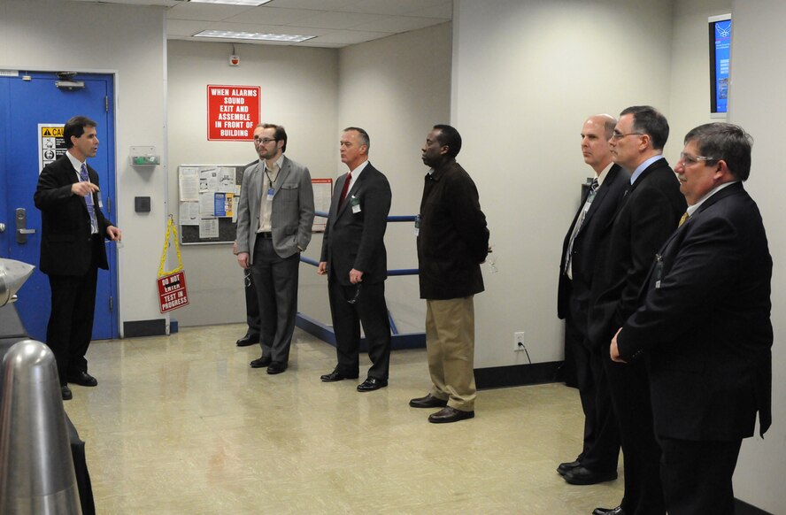 Tunnel 9 Director Dan Marren was the tour spokesman during the COTE kick-off event at the AEDC-managed Hypervelocity Wind Tunnel 9. Participants (left to right) included Michael Kendra, Eric Marineau, Edward Greer, Derrick Hinton, Patrick Carrick, Ricky Peters and Tom Russell. (Photo provided)