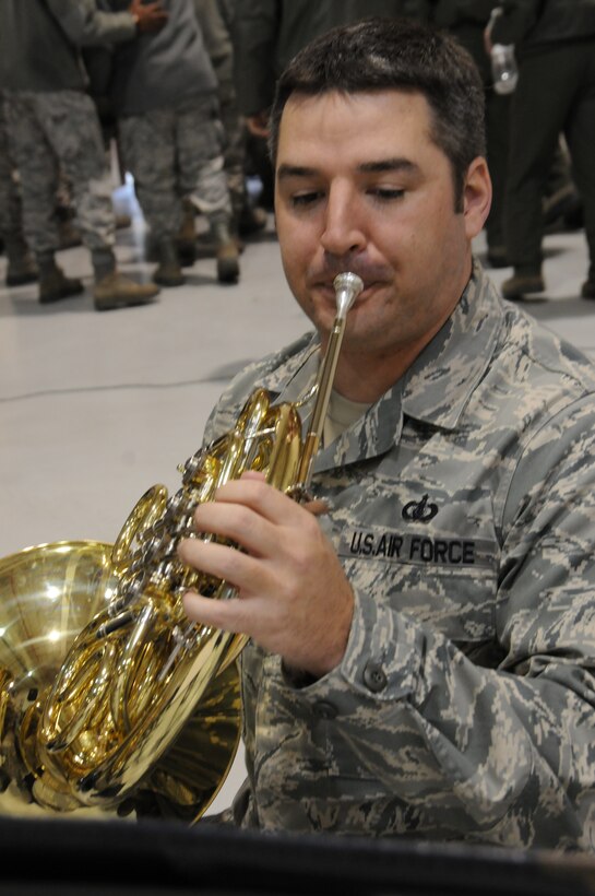 The 193d Special Operations Wing hosted a change of command ceremony on Sunday Feb 12, 2012.  Brass in Blue performed ceremonial music for the event.  Pictured is TSgt Jeremy Buss on French Horn.  (Photo by: Air National Guard Photographer, TSgt Culeen Shaffer)