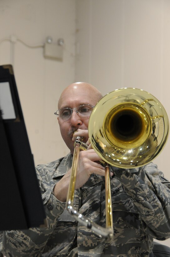 The 193d Special Operations Wing hosted a change of command ceremony on Sunday Feb 12, 2012.  Brass in Blue performed ceremonial music for the event.  Pictured is SSgt Clay Sattazahn on trombone.  (Photo by: Air National Guard Photographer, TSgt Culeen Shaffer)