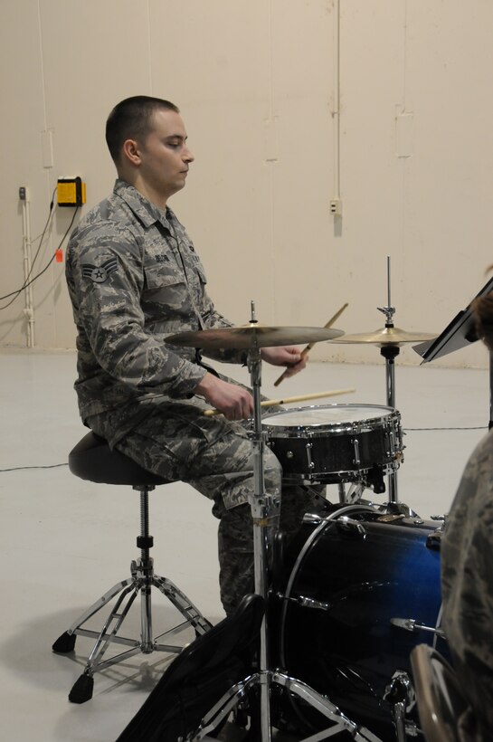 The 193d Special Operations Wing hosted a change of command ceremony on Sunday Feb 12, 2012.  Brass in Blue performed ceremonial music for the event.  Pictured is SrA Clayton Belcher on drum set.  (Photo by: Air National Guard Photographer, TSgt Culeen Shaffer)