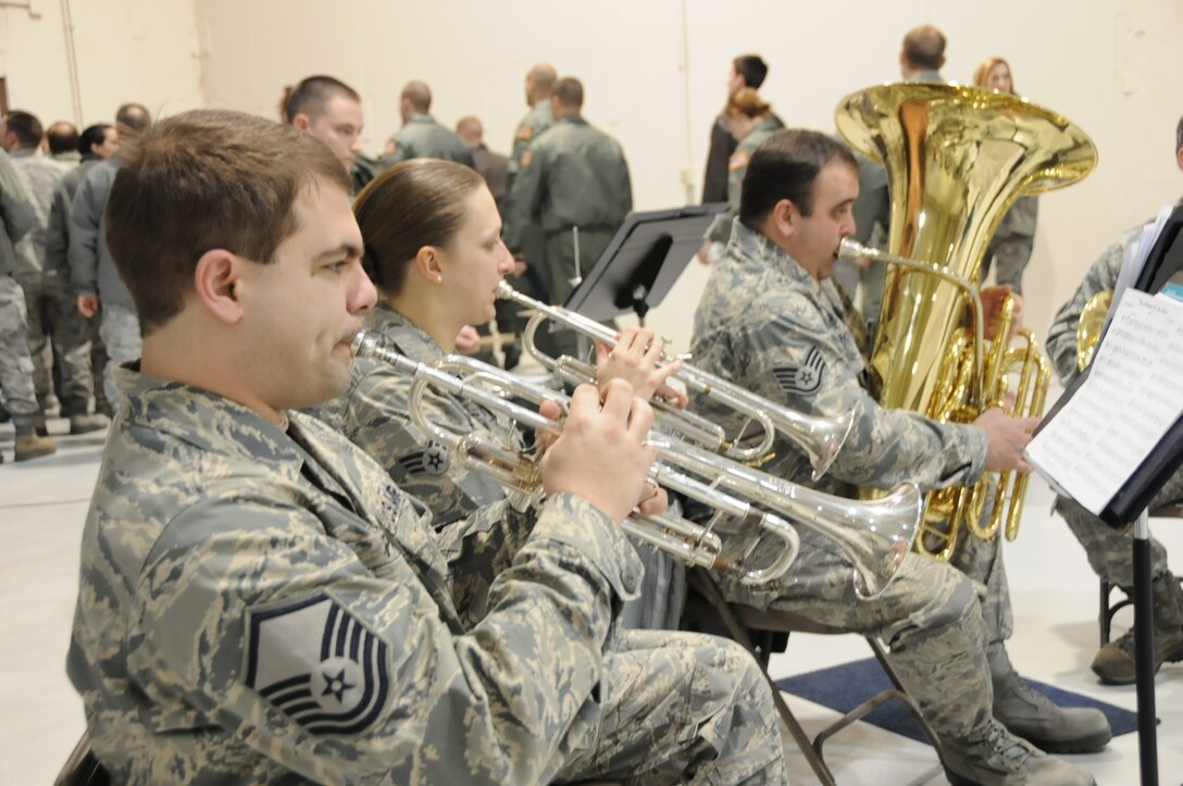 The 193d Special Operations Wing hosted a change of command ceremony on Sunday Feb 12, 2012.  Brass in Blue performed ceremonial music for the event.  Pictured are MSgt Jeffrey Pautz and SrA Alicia Brackbill on trumpet and SSgt Matthew Holmberg on tuba.  (Photo by: Air National Guard Photographer, TSgt Culeen Shaffer)