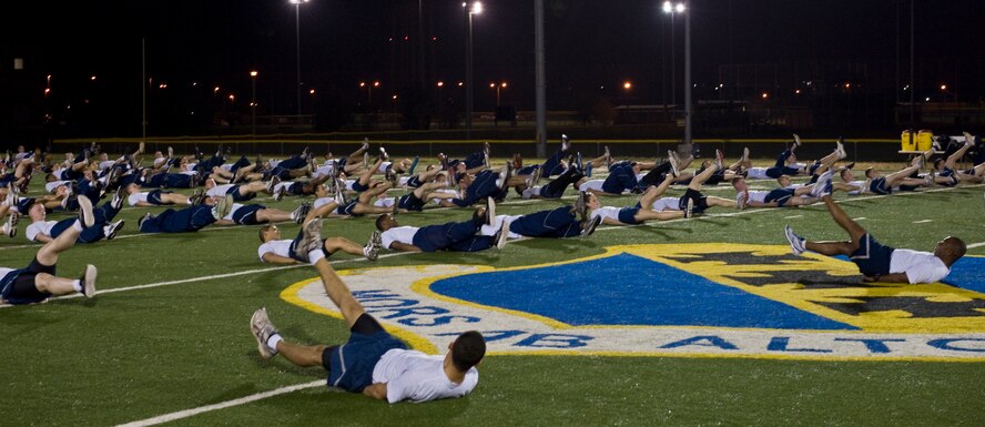 U.S. Air Force Chief Master Sgt. Kenneth Lindsey, 7th Bomb Wing command chief, leads physical training March 14, 2012, at Dyess Air Force Base, Texas. Lindsey introduced himself to the Dyess airmen and stressed the importance of being fit to fight. (U.S. Air Force photo by Airman 1st Class Jonathan Stefanko/ Released)