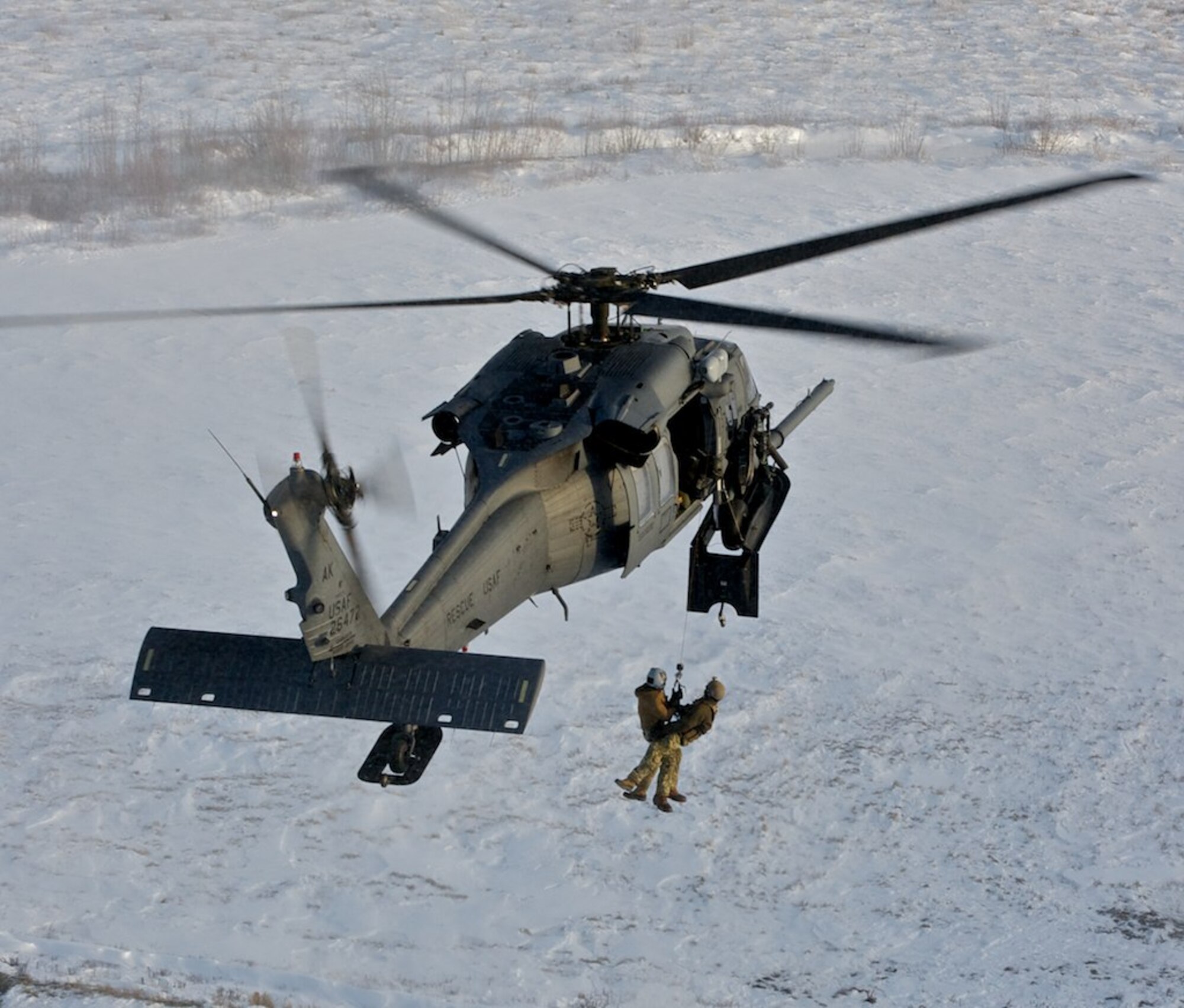 Alaska Air National Guard crews practicing hoist maneuver. Photo by MSgt Sean Mitchell.
