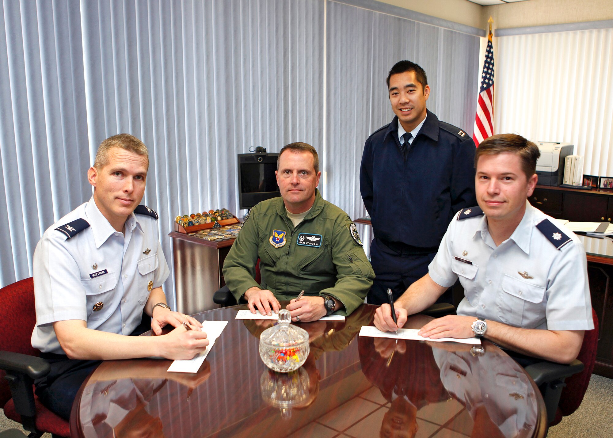 Col. Garvin McGettrick (from left), Air Force Operational Test and Evaluation Center Detachment 5 commander, Col. Gary Cooper, AFOTEC Detachment 1 commander, and Lt. Col. Steven Tittel, 31st Test and Evaluation Squadron commander, prepare to fill out their AFAF contribution forms March 12. The AFAF campaign officially kicked off March 5 and will run until April 13, 2012. This year's campaign goal is $58,400. (U.S. Air Force photo by Jet Fabara)