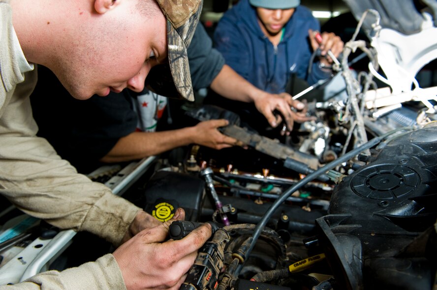 U.S. Air Force Airman 1st Class Andrew Ludwig, 7th Logistics Readiness Squadron, diagnosis a vehicle March 10, 2012, at Beltway Garage, in Abilene, Texas. Beltway Garage, a volunteer garage, is open on the first and third Saturday of every month from 9:00 a.m. to 12:00 p.m. Volunteers diagnose vehicles, change brakes, fix minor repairs and provide oil changes for the under privileged. (U.S. Air Force photo by Airman 1st Class Jonathan Stefanko/ Released)