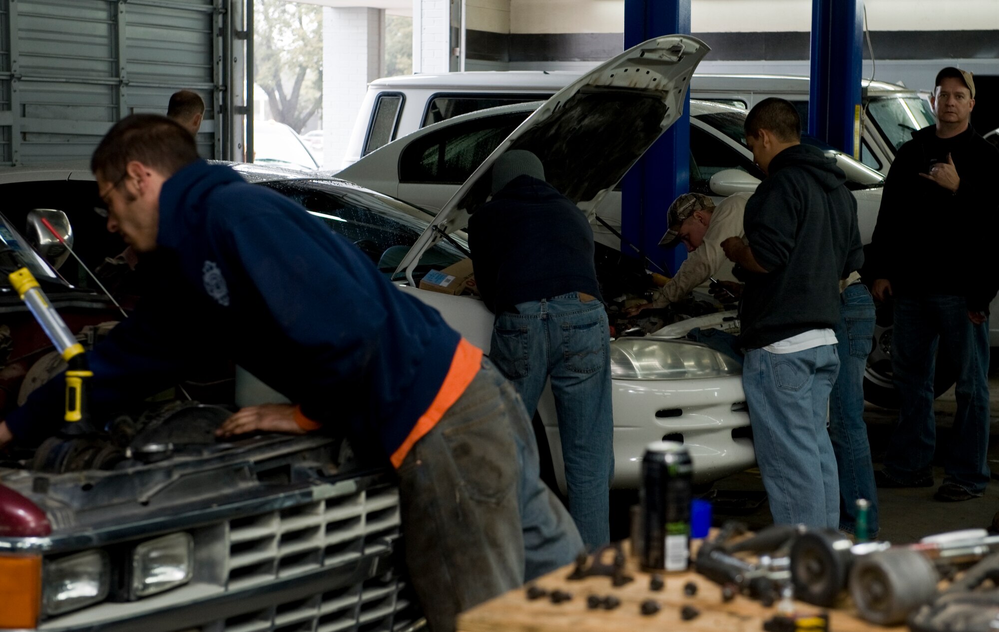 Dyess airmen volunteer to fix vehicles March 10, 2012, at Beltway Garage, in Abilene, Texas. Beltway Garage, a volunteer garage, is open on the first and third Saturday of every month from 9:00 a.m. to 12:00 p.m. Volunteers diagnose vehicles, change brakes, fix minor repairs and provide oil changes for the under privileged. (U.S. Air Force photo by Airman 1st Class Jonathan Stefanko/ Released)