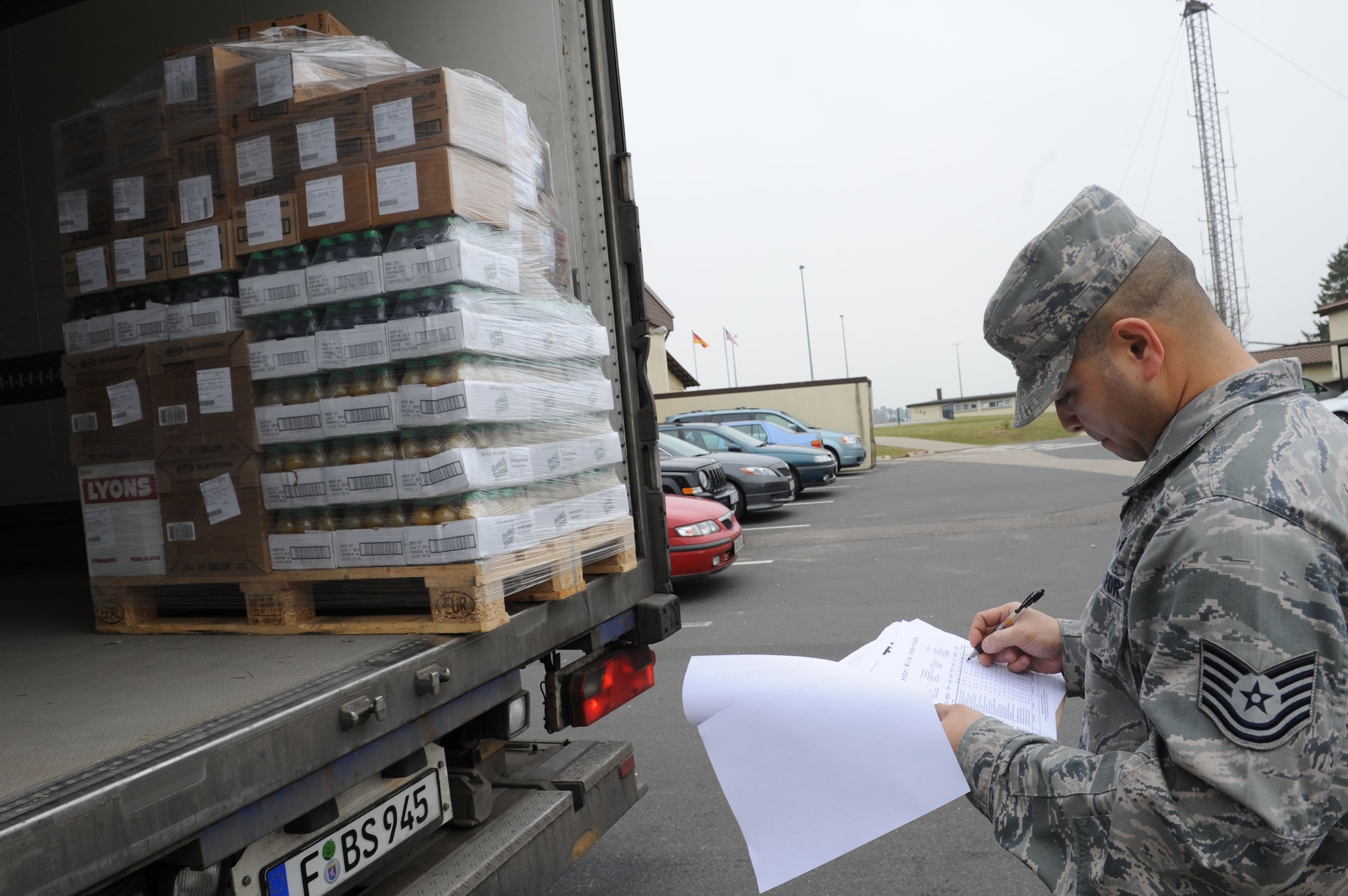 SPANGDAHLEM AIR BASE, Germany – Tech. Sgt. Andrews Adinig, 52nd Force Support Squadron dining facility assistant manager, verifies the quality and quantity of food products during a delivery at the Mosel Hall Dining Facility here March 13. The DFAC provides fresh meals to more than 4,270 enlisted service members on a daily basis to include breakfast, lunch, dinner and midnight meals. In addition, they provide service to all Department of Defense civilians, military service members and reserve officer training corps cadets with temporary duty orders. The DFAC also provides service to all family members and retirees on a case by case base, such as Thanksgiving, Christmas and Air Force birthdays. (U.S. Air Force photo by Senior Airman Christopher Toon/Released)