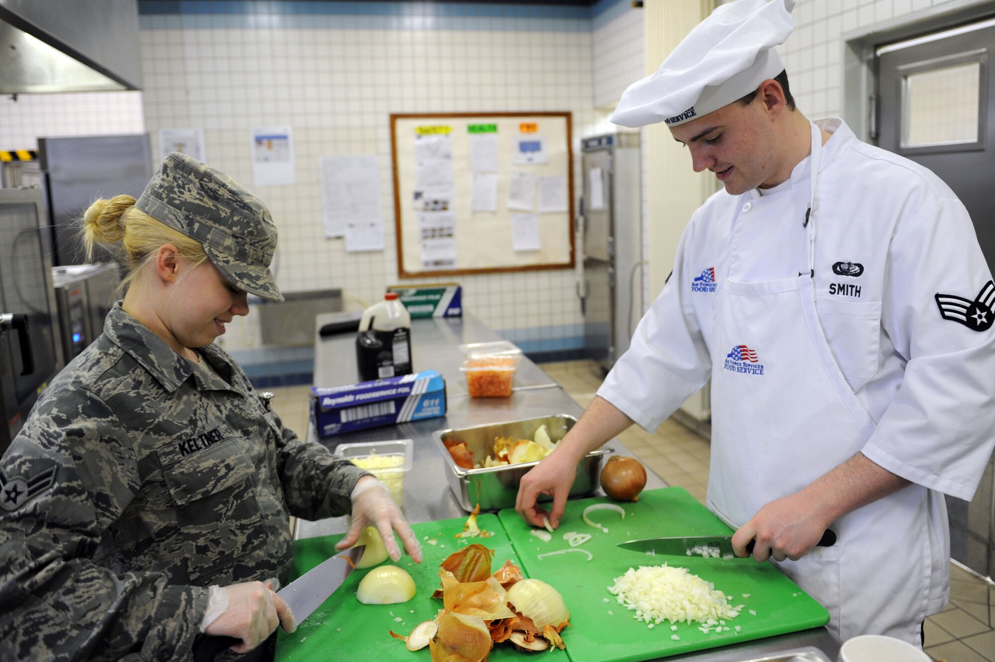 SPANGDAHLEM AIR BASE, Germany – Airman 1st Class Shilah Keltner and Senior Airman Patrick Smith, 52nd Force Support Squadron food service journeymen, prep onions for the lunch meal service at the Mosel Hall Dining Facility here March 13. The DFAC provides fresh meals to more than 4,270 enlisted service members on a daily basis to include breakfast, lunch, dinner and midnight meals. In addition, they provide service to all Department of Defense civilians, military service members and reserve officer training corps cadets with temporary duty orders. The DFAC also provides service to all family members and retirees on a case by case base, such as Thanksgiving, Christmas and Air Force birthdays. (U.S. Air Force photo by Senior Airman Christopher Toon/Released)