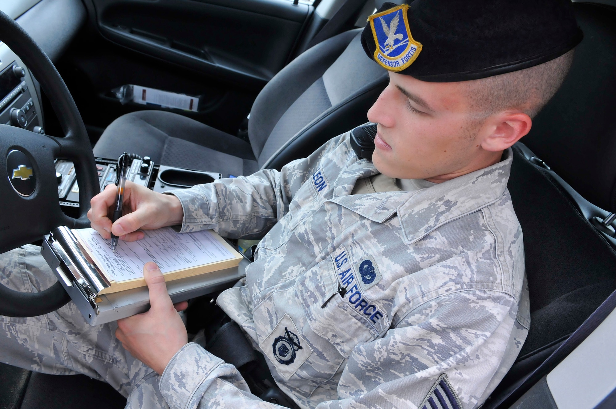 Staff Sgt. Jonathan Leon, 78th Security Forces Squadron, is responsible for ensuring the safety of motorists at Robins. Violators will receive a notice to appear in U.S. Magistrate Court in Macon and could face monetary fines.  (U. S. Air Force photo illustration by Sue Sapp)