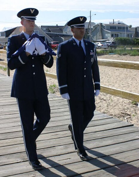 HANSCOM AIR FORCE BASE, Mass. – First Lt. Mitchell Johnson (left), along with another honor guard member, performs a “burial at sea” funeral detail for a United States Air Force veteran. Johnson is the AFMC nominee for the Spirit of Hope Award because of his commitment and dedication as a volunteer with the Hanscom Patriot Honor Guard and within the local community. (Courtesy photo)