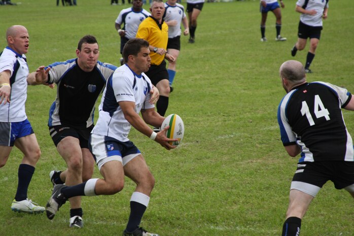 1st Lt. Chris Valine attempts to pass the ball during the championship match at the 34th Annual St. Patrick’s Day Rugby tournament in Savannah, Ga., March 10-12. Throughout the tournament, the U.S. Air Force team had to win matches against both Army and Navy before reaching the championship game against Gypsy Rugby, winning 56-0. For almost 10 years, the U.S. Air Force Rugby team has used this tournament to prepare for the Armed Forces Rugby Championship which sees teams from military services around the world compete. Air Force has won the Armed Forces title eight consecutive years. The Armed Forces tournament is Aug. 17-20 in Glendale, Co. Valine is a pilot with the 30th Airlift Squadron, 153rd Airlift Wing, Wyoming Air National Guard. (U.S. Air Force photo/1st Lt. Susan Carlson