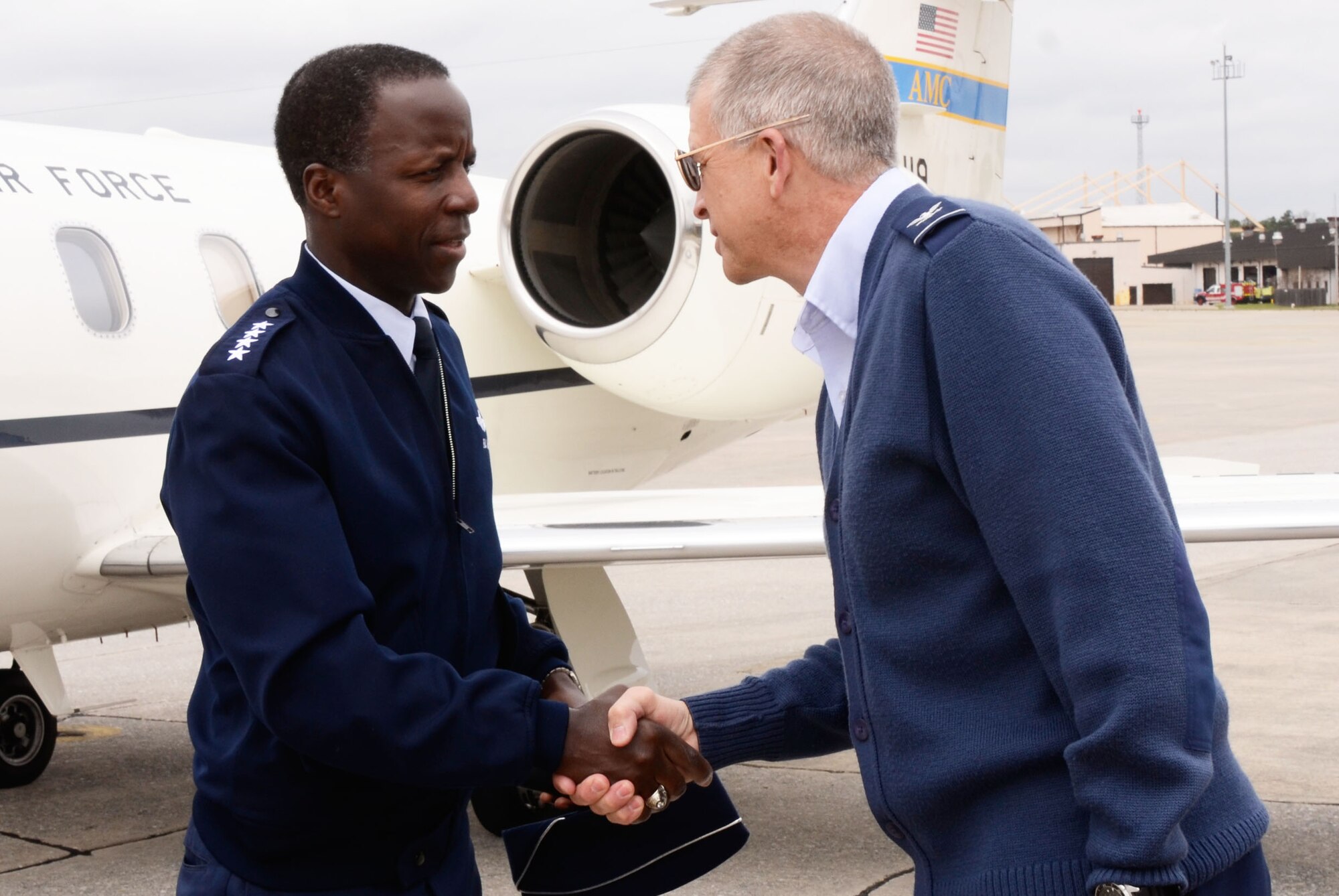 Gen. Edward A. Rice Jr., Air Education and Training Command, commander, Randolph Air Force Base, Texas is greeted by Col. Timothy E. Tarchick, 94th Airlift Wing commander upon his arrival here March 12. (U.S. Air Force photo/Don Peek)