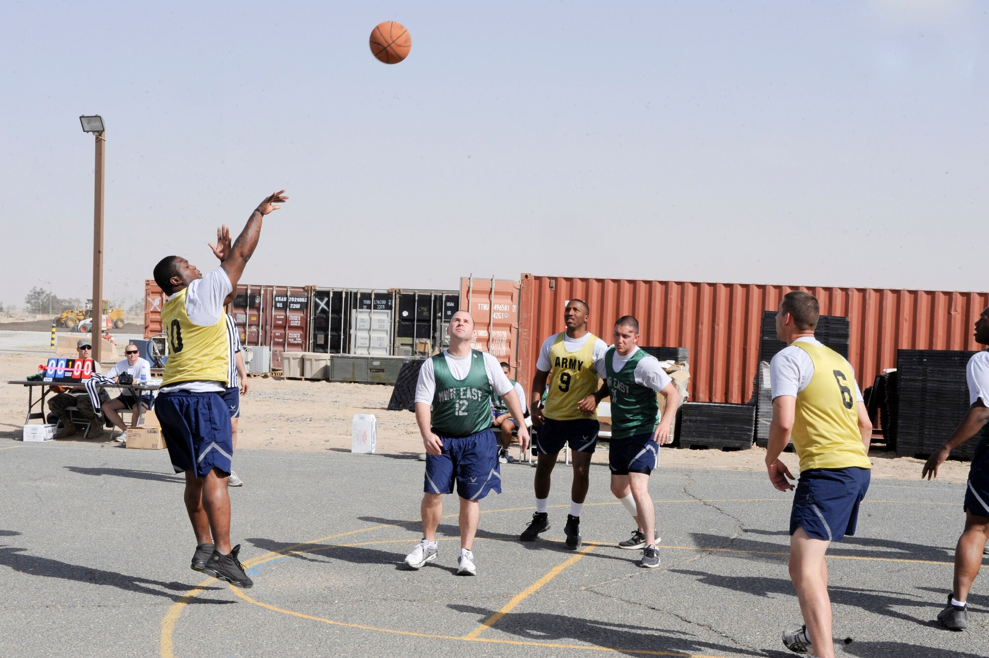Senior Airman Marcus Patrick, 332nd Expeditionary Security Forces Squadron member, shoots a 2-point jump shot during an intramural basketball game at an undisclosed location in Southwest Asia, March 9, 2012. The intramural basketball league consists of twenty games between five teams. Patrick is deployed from Lackland Air Force Base, Texas. (U.S. Air Force photo by Staff Sgt. Joshua J. Garcia/Released