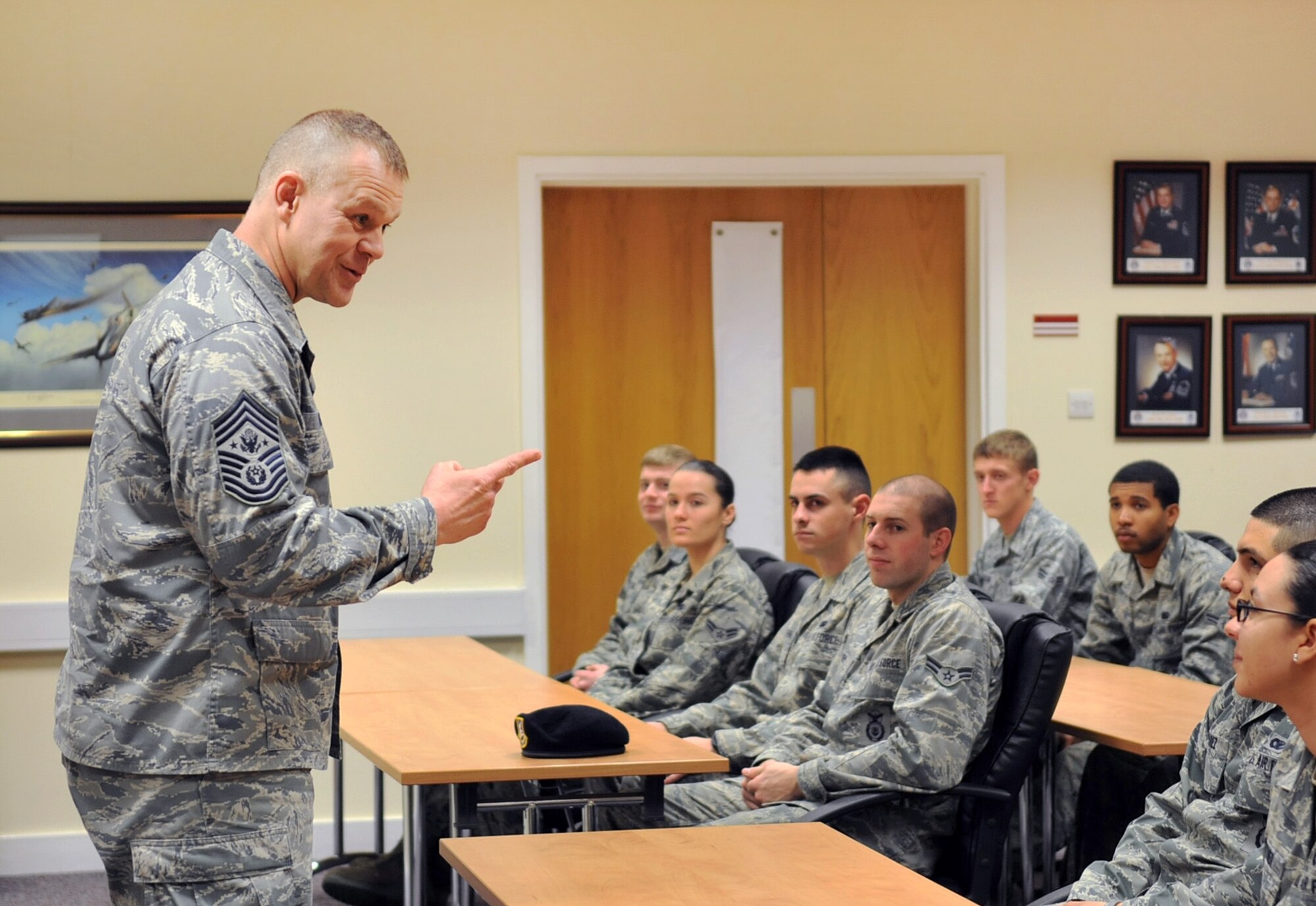 RAF MILDENHALL, England -- Chief Master Sgt. of the Air Force James Roy speaks to Airmen at the First Term Airmen Center here March 13, 2012. During his visit to the base, Roy also met with a group of first line supervisors and hosted an all call for RAF Mildenhall and RAF Lakenheath personnel. (U.S. Air Force photo/Senior Airman Jerilyn Quintanilla)