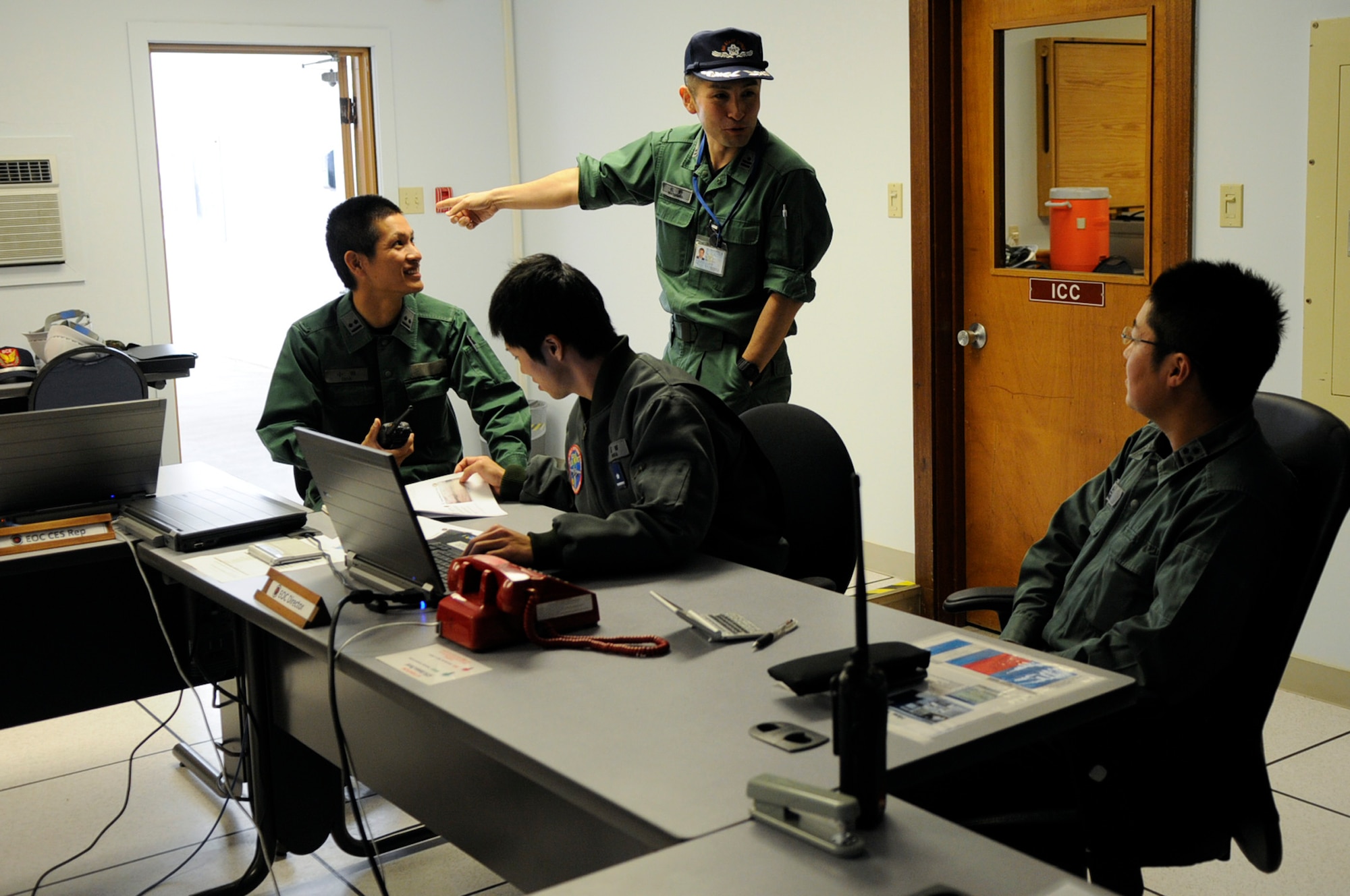 Engineers Koku Jieitai, or Japan Air Self-Defense Force, train for command and control by overseeing and documenting each stage of the runway crater repair during a class at the U.S. Air Force Detachment 1, 554th RED HORSE Squadron training site on Kadena Air Base, Japan, March 13, 2012. Training with the Japanese builds on the strong bilateral friendship between the U.S. military and Japan's defense forces. (U.S. Air Force photo by Airman 1st Class Tara A. Williamson/Released)