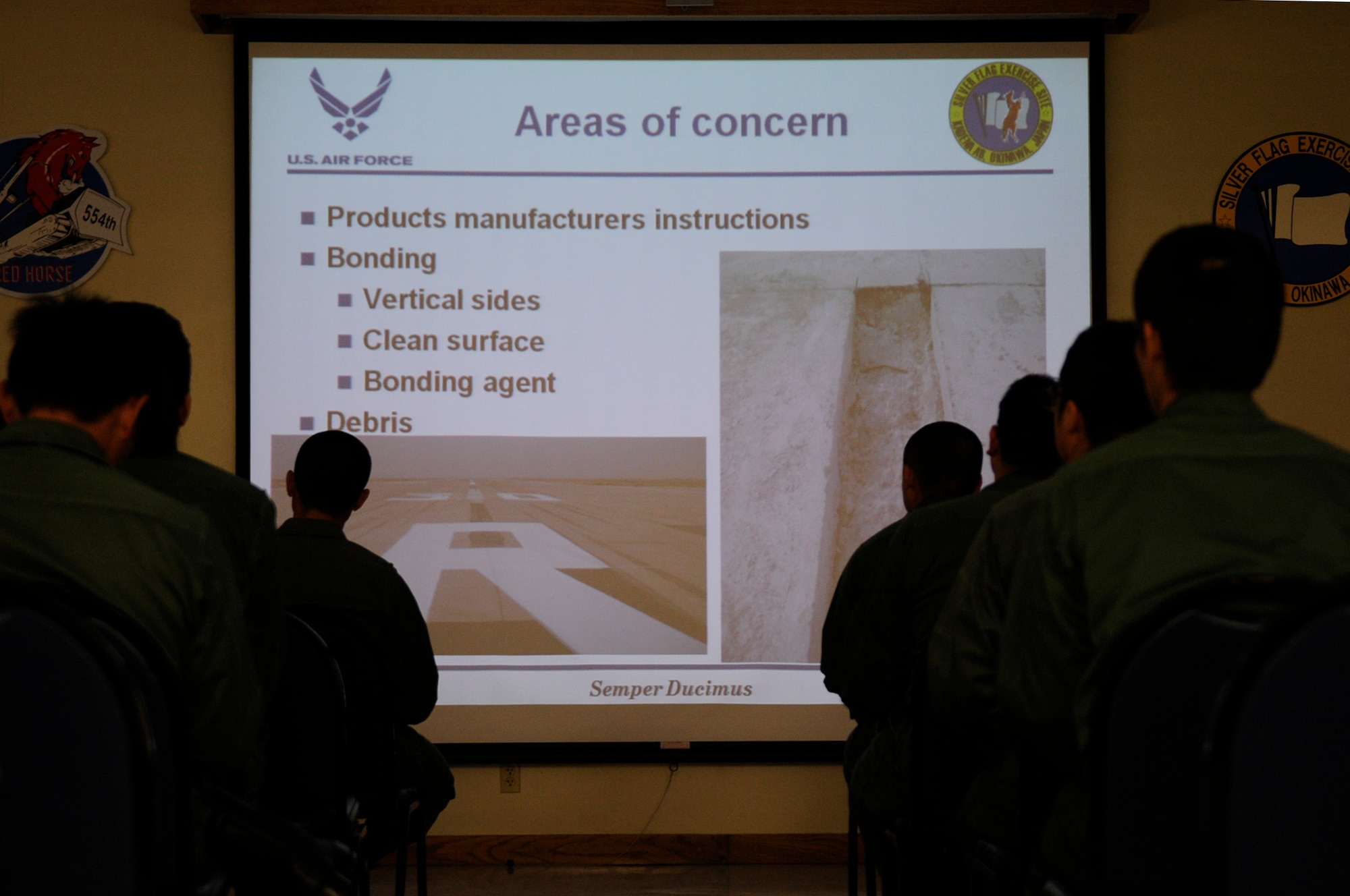 Engineers of the Koku Jieitai , or Japan Air Self-Defense Force, take a class on runway crater repair and command and control provided by the U.S. Air Force Detachment 1, 554th RED HORSE Squadron to learn more practical methods of repairing runway damages on Kadena Air Base, Japan, March 12, 2012. The classroom portion of the training was conducted March 8-12 and taught the Japanese engineers how to get their runways operational if they were damaged. (U.S. Air Force photo by Airman 1st Class Tara A. Williamson/Released)