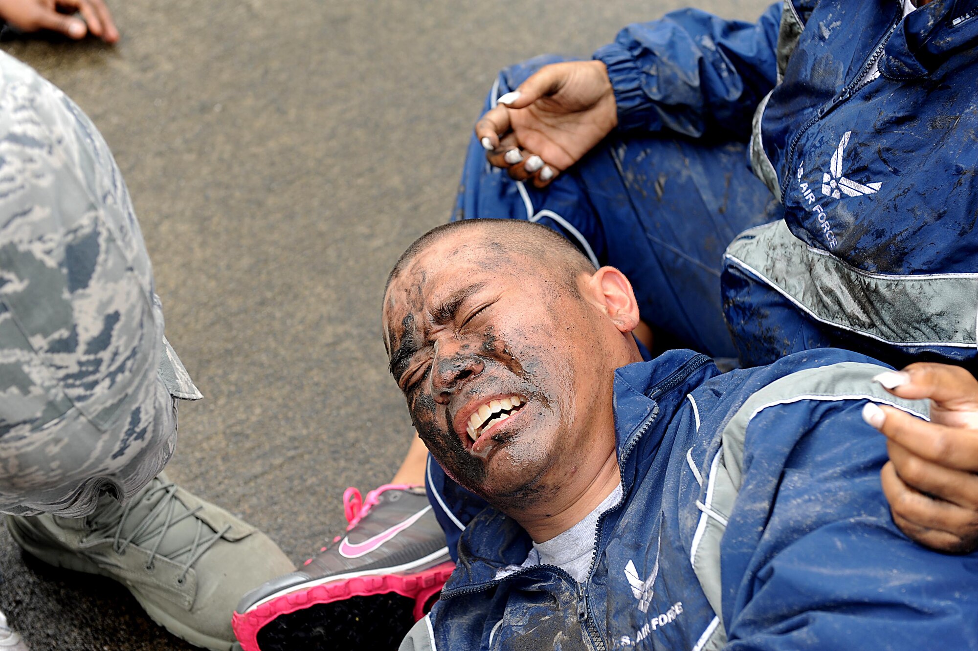 A simulated victim cries out in agony during a mass training exercise for local operational readiness exercise Beverly High 12-3 on Kadena Air Base, March 14, 2012. Having Airmen with moulage and acting as injured victims allows other Airmen to practice self-aid and buddy care skills effectively. (U.S. Air Force photo by Airman 1st Class Brooke P. Beers/Released)