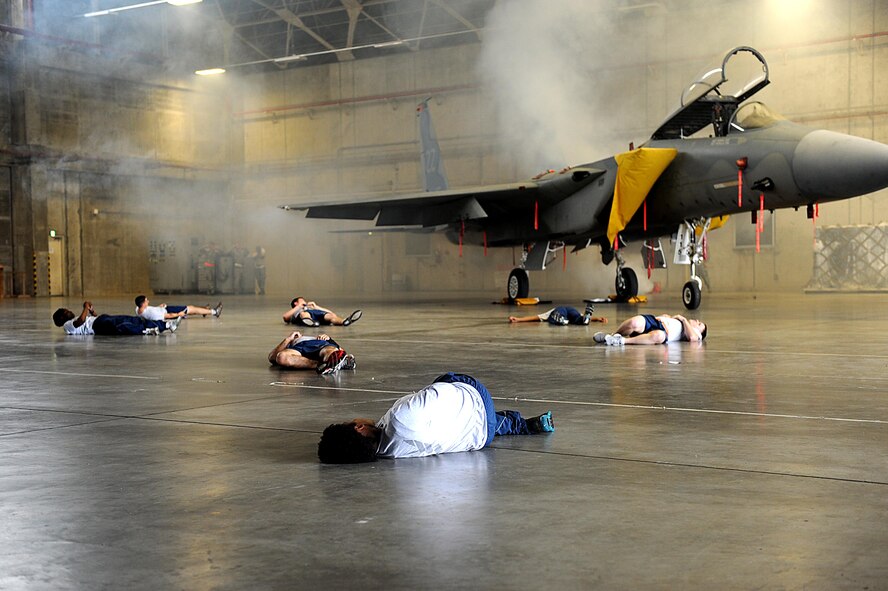 Volunteers act as victims of an explosion during a training scenario for local operational readiness exercise Beverly High 12-3 on Kadena Air Base, March 14, 2012. LOREs offer Airman the chance to practice different skill sets for possible contingencies while in a safe environment.  (U.S. Air Force photo by Airman 1st Class Brooke P. Beers/Released)