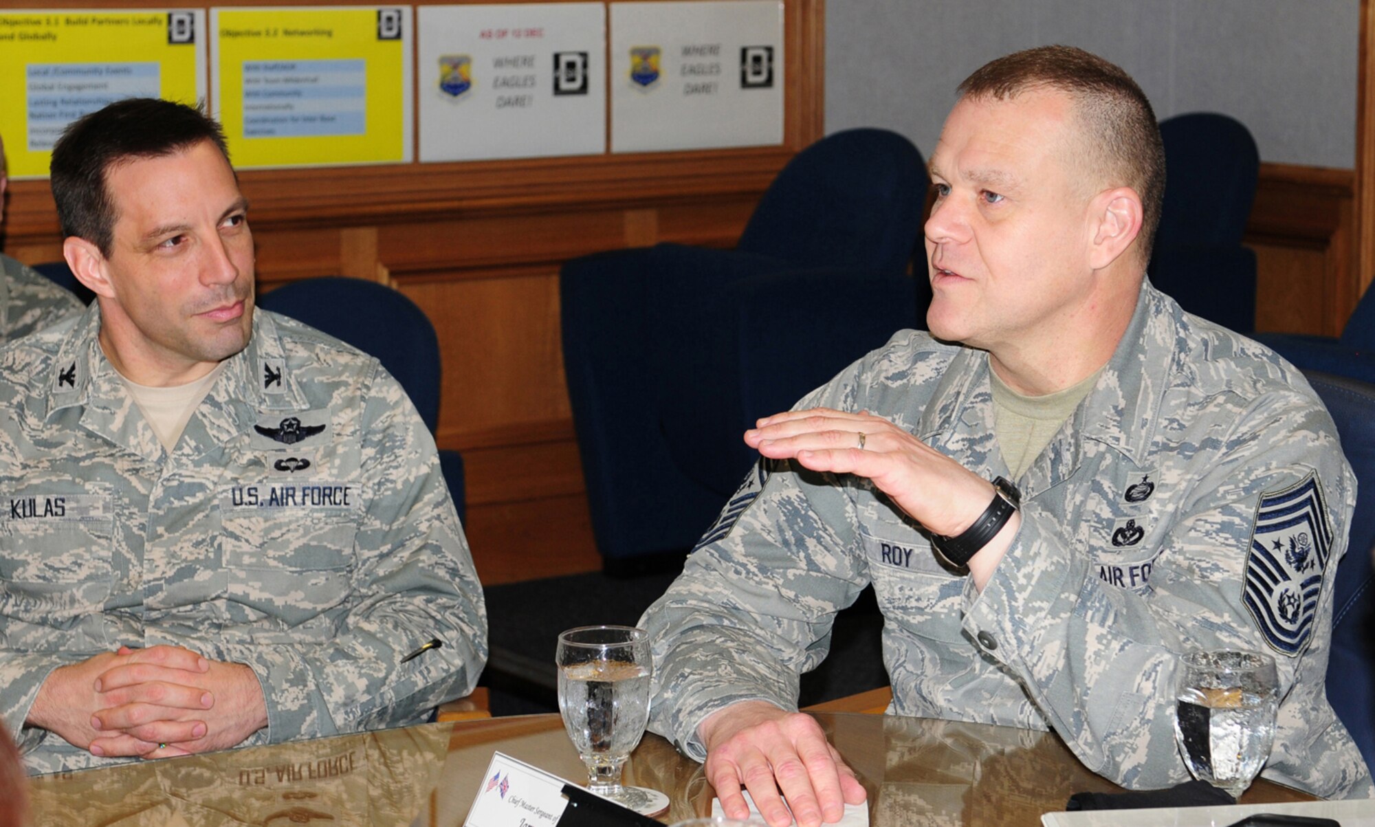 RAF MILDENHALL, England -- Chief Master Sgt. of the Air Force James Roy, right, speaks to Col. Christopher Kulas, 100th Air Refueling Wing  commander, about the 100th ARW mission during a briefing at wing headquarters March 13, 2012. Airmen and senior NCOs from the 100th ARW, 352nd Special Operations Group and 95th Reconnaissance Squadron, all briefed Roy on their units’ accomplishments. (U.S. Air Force photo/Karen Abeyasekere)
