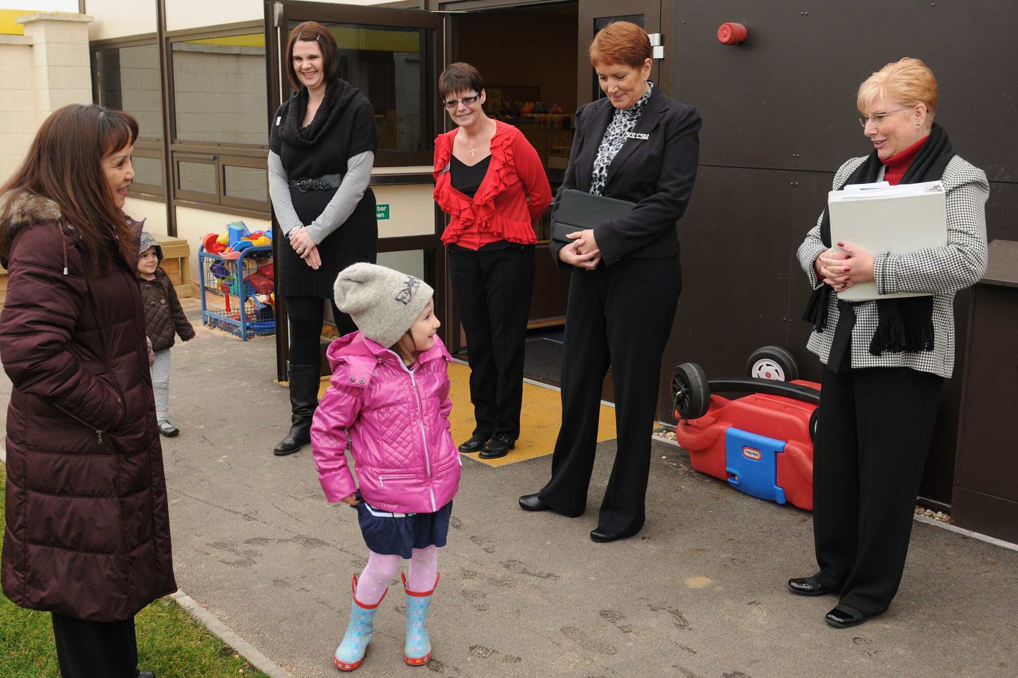 RAF CROUGHTON, United Kingdom - Paula Roy, wife of Chief Master Sgt. of the Air Force James Roy, chats with Camilla Minarov, daughter of Staff Sgt. Zafar Minarov, 422nd Air Base Group, at the RAF Croughton Child Development Center March 12. (U.S. Air Force photo by Senior Airman Joel Mease)