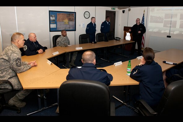 RAF CROUGHTON, United Kingdom - Terence Moody, Ministry of Defence Police, describes security operations at the 421st Air Base Group to Chief Master Sgt. of the Air Force James Roy March 12. Moody highlighted how MDP is responsible for the security to enable communications and intelligence at RAF Menwith Hill. (U.S. Air Force photo by Tech. Sgt. John Barton)